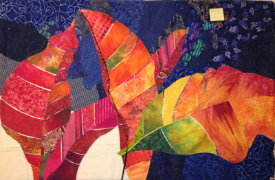 Image - colorful Croton leaves against a blue background