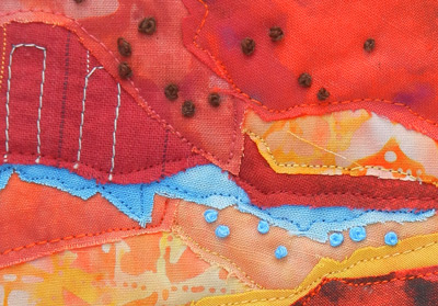 Image - red and orange collage with embroidery detail