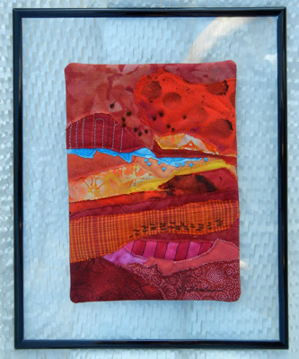 Image - red collage mounted on glass see-through frame