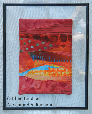 Image - Abstract red collage framed with a glass floating frame