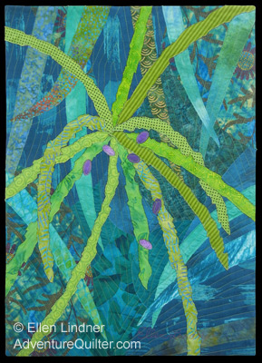 Image - yellow-green palm twigs against a blue-green background