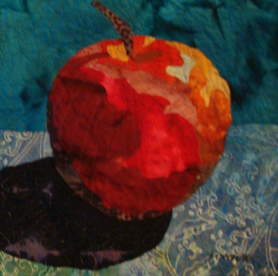 Image - red apple on teal background