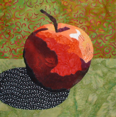 Image - red apple on green background
