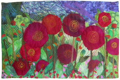 Image - large red flowers on green background
